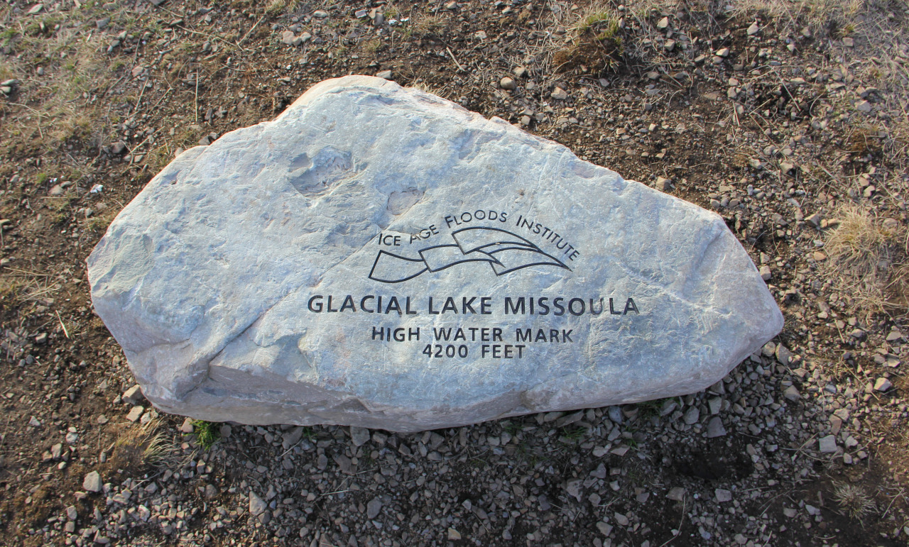 A boulder on Mount Sentinel engraved by the Ice Age Floods Institute: Glacial Lake Missoula High Water Mark, 4200 Feet